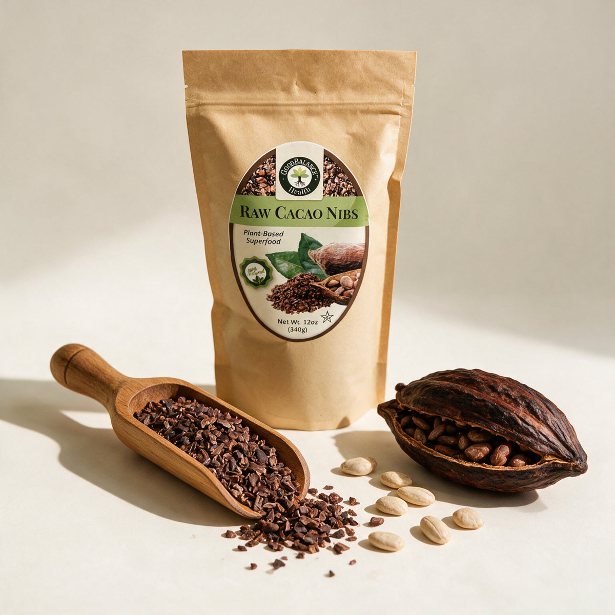 Raw cacao nibs in a wooden scoop next to a cacao pod